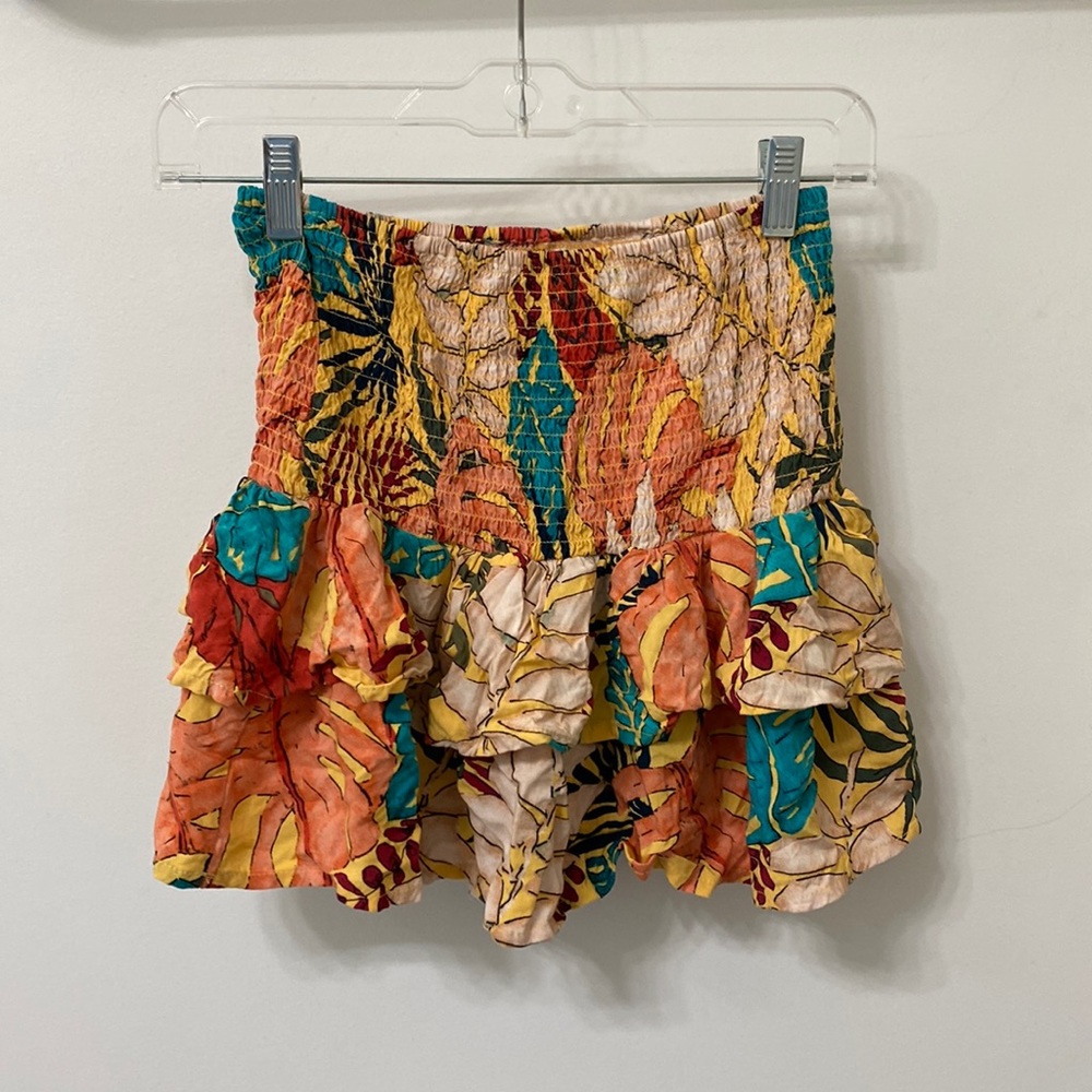 Cute floral design skirt. Smoked on the top and ruffled on the bottom